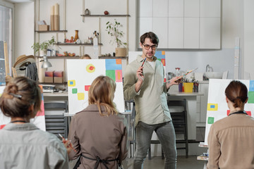 Poster - Young confident teacher of painting course standing in front of audience