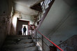 © erika8213 - Dramatic portrait of a man wearing a gas mask in a ruined building.