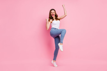 Poster - Full length photo of delighted cheerful girl enjoy her sport competition victory raise fists scream yeah wear good look modern clothing isolated over pastel color background