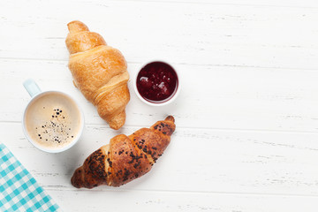 Breakfast with coffee and croissants