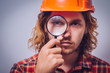 © aeroking - builder with magnifying glass