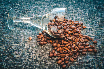 coffee beans in bag on burlap background