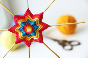 Wall Mural - Wicker mandala made of blue yarn on wooden toothpicks. Flower  or star pattern.