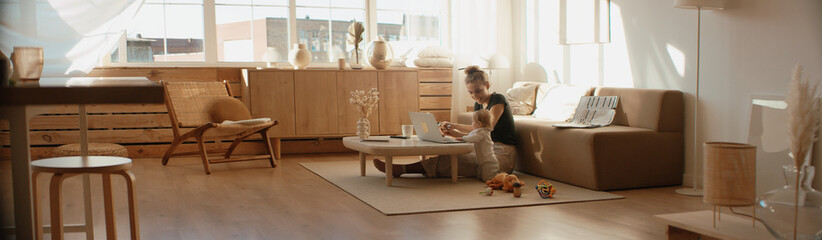 caucasian mother working from home, having a work video call, daughter playing nearby. stay home, qu