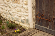 Old Wooden Weathered Castle Door With Wrought Iron