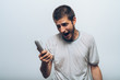 © aeroking - Close up image of a man screaming on the telephone during the conversation.