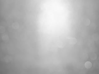 White and gray  bokeh background.Abstract blur background. White bubbles on a black background.