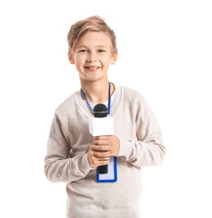 Little journalist with microphone on white background