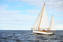 Old Expensive Vintage Wooden Sailboat (yawl) Close-up, Sailing In An Open Sea. Stunning Cloudscape. Coast Of Maine, US