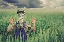 The Child In The Gas Mask.  Concept Of Environment Pollution And  Natural Disaster. Coronovirus Epidemic.