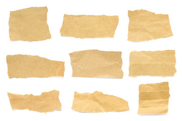 Recycled paper craft stick on a white background. Brown paper torn or ripped pieces of paper isolated on white background.	