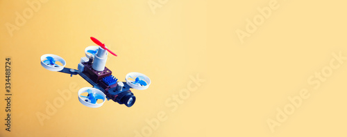 Fotografía Abstract prototype spy drone on yellow background