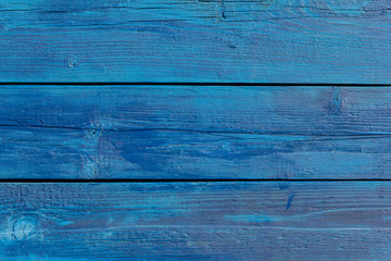 Wall Mural - Old blue wooden background with cracks and stripes