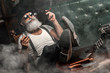 Old man smoking a cigar indoors. Mafia concept. Stylish male in his cabinet. Bearded man.