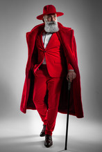 Stylish Old Man In The Red Suit. Fashioned Male. Handsome Man Studio Shot.