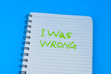 Sticker - I was wrong written on a white spiraled diary in front of a blue background