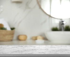 Canvas Print - Empty table and blurred view of stylish bathroom interior