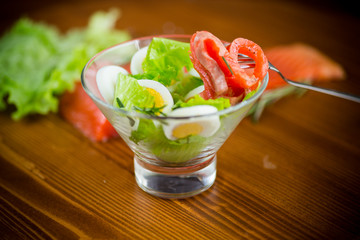 Wall Mural - lettuce salad with salted salmon, boiled eggs