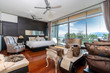 © korakoch - Bedroom with window glass door, ceiling fan and wooden flooring in pool villa, house, home, condo and apartment