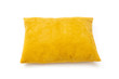 Yellow cushion close up on white background