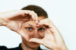© aeroking - man making a hand heart frame