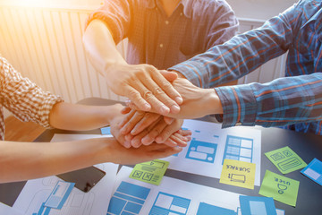 soft focus and blur,a group of web designers are working together to develop a mobile responsive web
