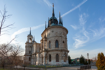 Wall Mural - Church of the Vladimir Icon of the Mother of God in Bykovo (Russia), illuminated by the rays of the setting sun