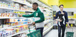 © Robert Daly/Caia Image - Men shopping in supermarket