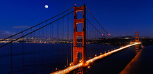Panorama Of Golden Gate Bridge And San Francisco Skyline At Night With Rising Moon