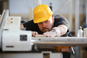 Worker using electric saw portrait. Manual job workplace DIY inspiration improvement fix shop yellow helmet hard hat joinery startup idea industrial education profession career concept