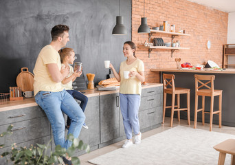 Young family in kitchen at home