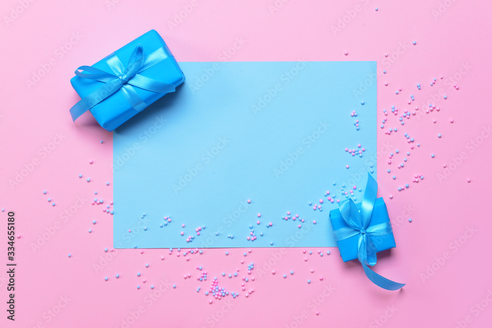 Birthday gifts and blank card on color background