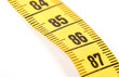 © michaklootwijk - Close-up of a yellow measuring tape isolated on white - 86