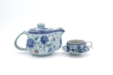 Wall Mural - cup with tea and teapot on white  background, over light