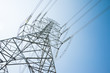 © pla2na - Abstract pattern from bottom view of high voltage pole power transmission tower with clear sky sunny day background. Green energy, environmental conservation concept.
