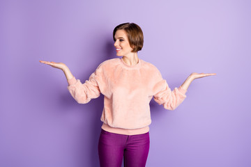 Sticker - Portrait of cheerful positive girl hold hand select suggest option promo ads enjoy black friday offer wear pastel pullover isolated over violet color background