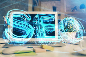 double exposure of table with computer and seo drawing hologram. search optimization concept.