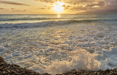 Wall Mural - Beautiful summer sunrise on Greek island Crete. Close-up of wave splash.