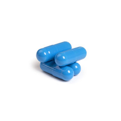 Blue pills isolated on white background