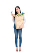 © Atstock Productions - Full length of beautiful Asian woman with credit card holding paper shopping bag full of groceries isolated on studio white background