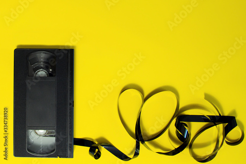 Fotomural Cassette for a VCR video recorder on a yellow background