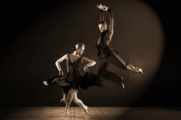 Wall Mural - Dancers in ballroom isolated on black background