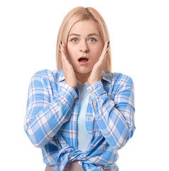 Shocked young woman on white background