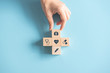 © oatawa - Health medical Insurance Concept, Hand arranging wood cube with medical symbol on pastel blue background, copy space.