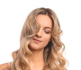 Wall Mural - Beautiful young woman with curly hair on white background