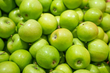 Sticker - Green fresh apples as a background