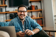 © bnenin - Happy man at home, portrait, close-up.