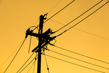 Silhouette Electrician Working On Electric Power Pole