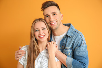 Sticker - Happy young couple on color background