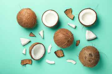 Wall Mural - Flat lay with coconut on mint background, top view